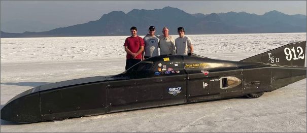 Land-speed streamliner and crew on the Bonneville Salt Flats