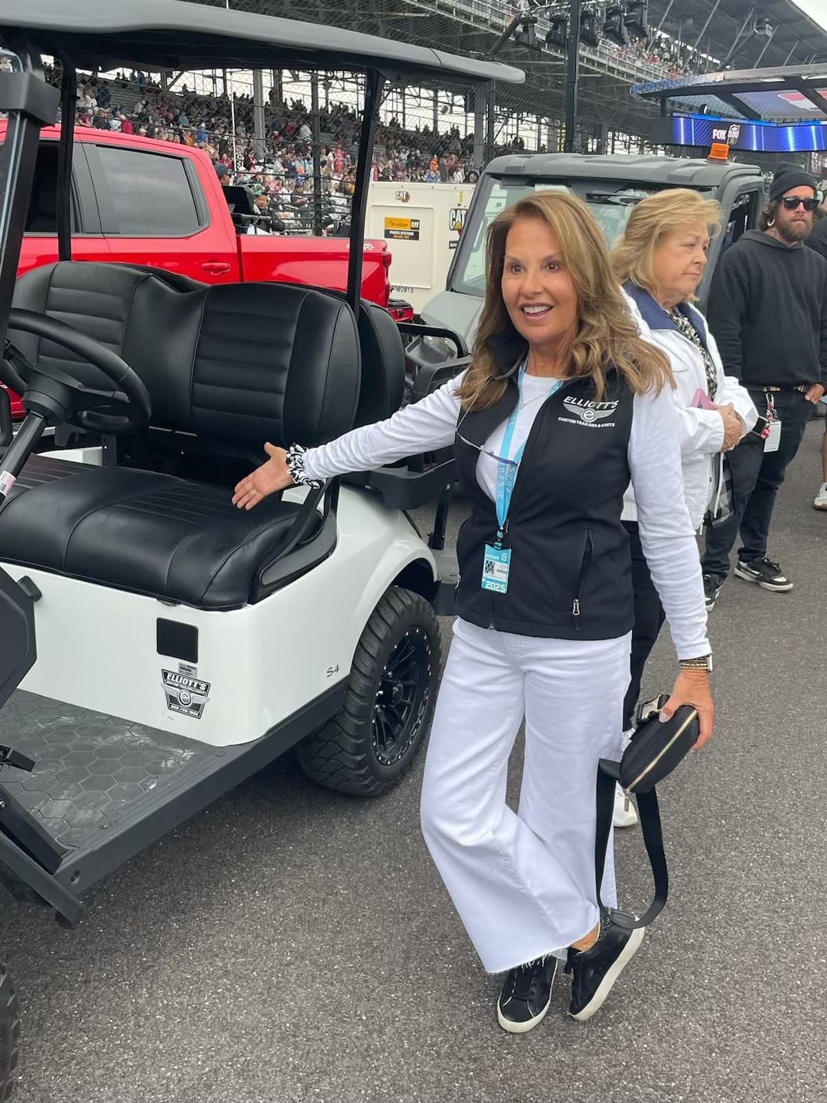 Cindy Elliott with Alex Palou's cart after winning the Indy 500!